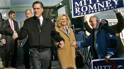 Mitt and Ann Romney leave the Elm Street School among cheering supporters after a town-hall meeting in Nashua, N.H.