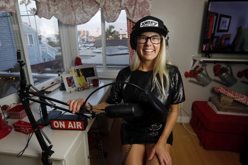 Newport Beach resident Nikki Chase in her home studio. Chase has started an irreverent podcast, Adult Chicken, about maneuvering through life's obstacles.
