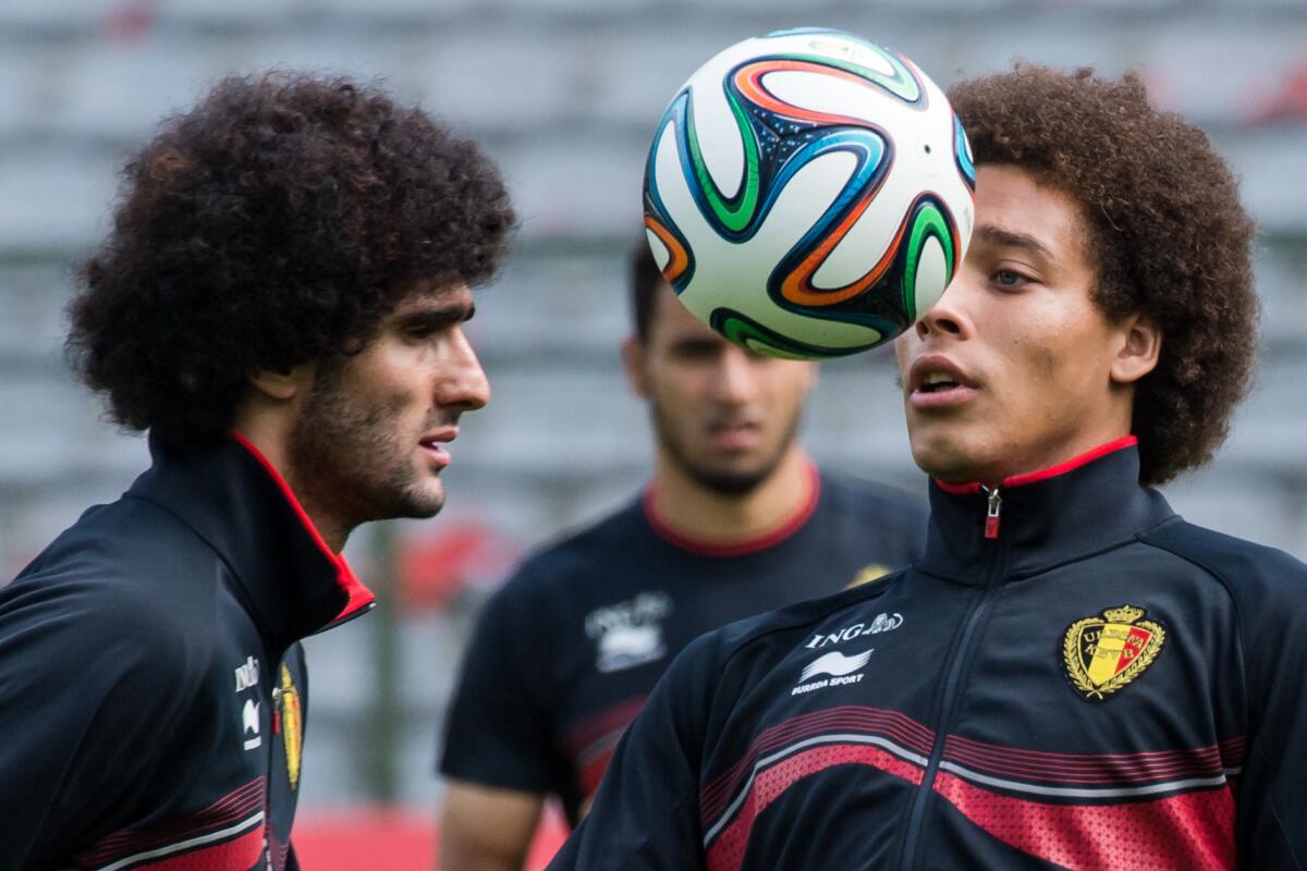 Belgium's national soccer team players Axel Witsel, right, and Marouane Fellaini practice during their last training session before leaving for Brazil.