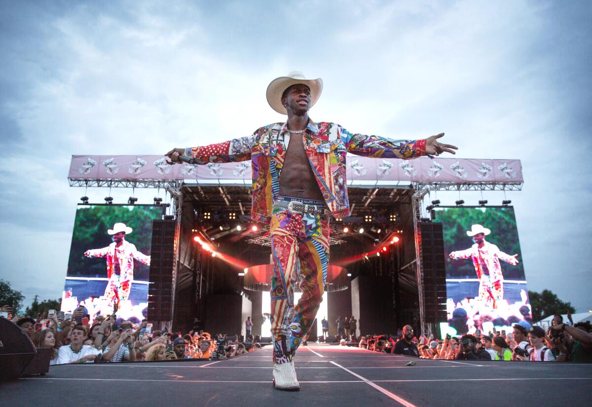 Lil Nas X and Elton John try on each other's clothes in hilarious video