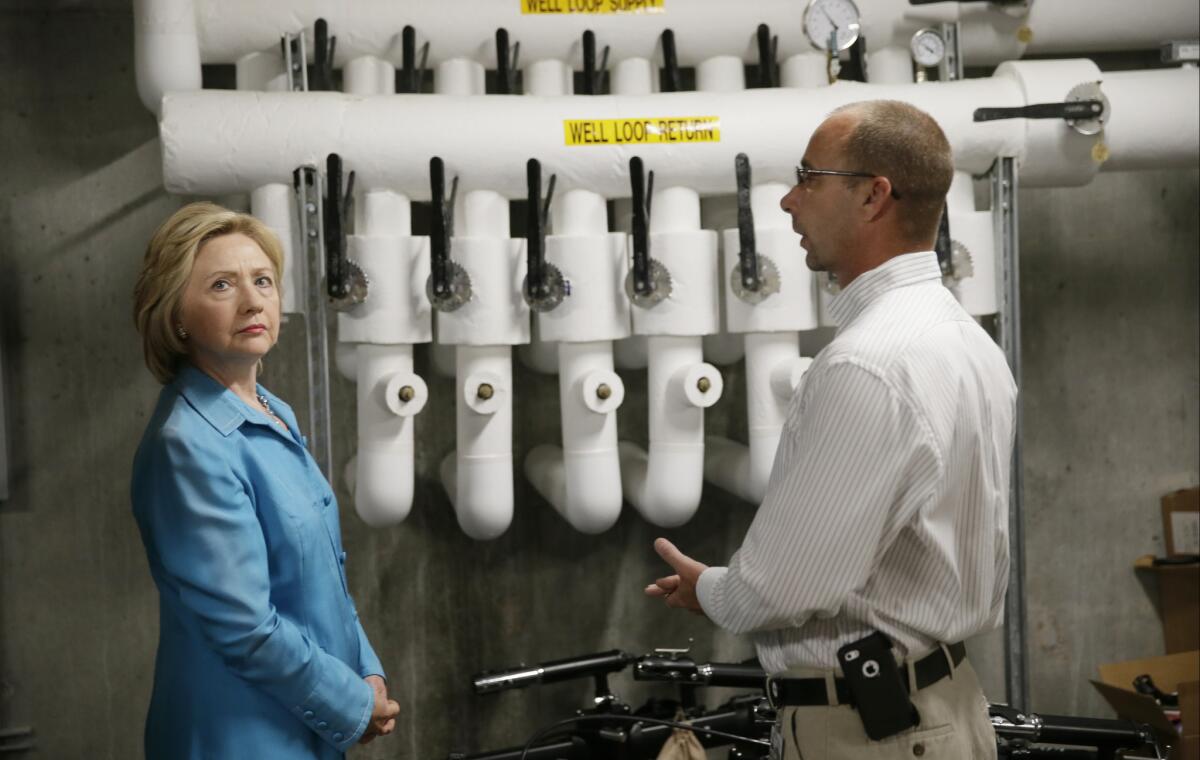 Democratic presidential candidate Hillary Rodham Clinton, shown touring the Des Moines Area Rapid Transit Central Station on Monday in Iowa, has pledged to keep Wall Street out of her inner circle if she wins the race for the White House. But progressives are skeptical.