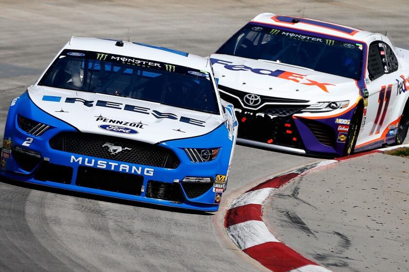 MARTINSVILLE, VA - MARCH 24: Brad Keselowski, driver of the #2 Reese/Draw Tite Ford, leads Denny Hamlin, driver of the #11 FedEx Ground Toyota, during the Monster Energy NASCAR Cup Series STP 500 at Martinsville Speedway on March 24, 2019 in Martinsville, Virginia. (Photo by Brian Lawdermilk/Getty Images) ** OUTS - ELSENT, FPG, CM - OUTS * NM, PH, VA if sourced by CT, LA or MoD **
