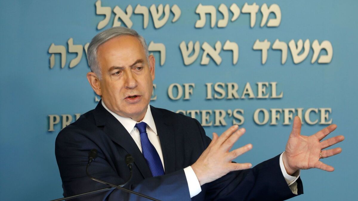 Israeli Prime Minister Benjamin Netanyahu speaks to the press in his Jerusalem office on April 2, 2018.