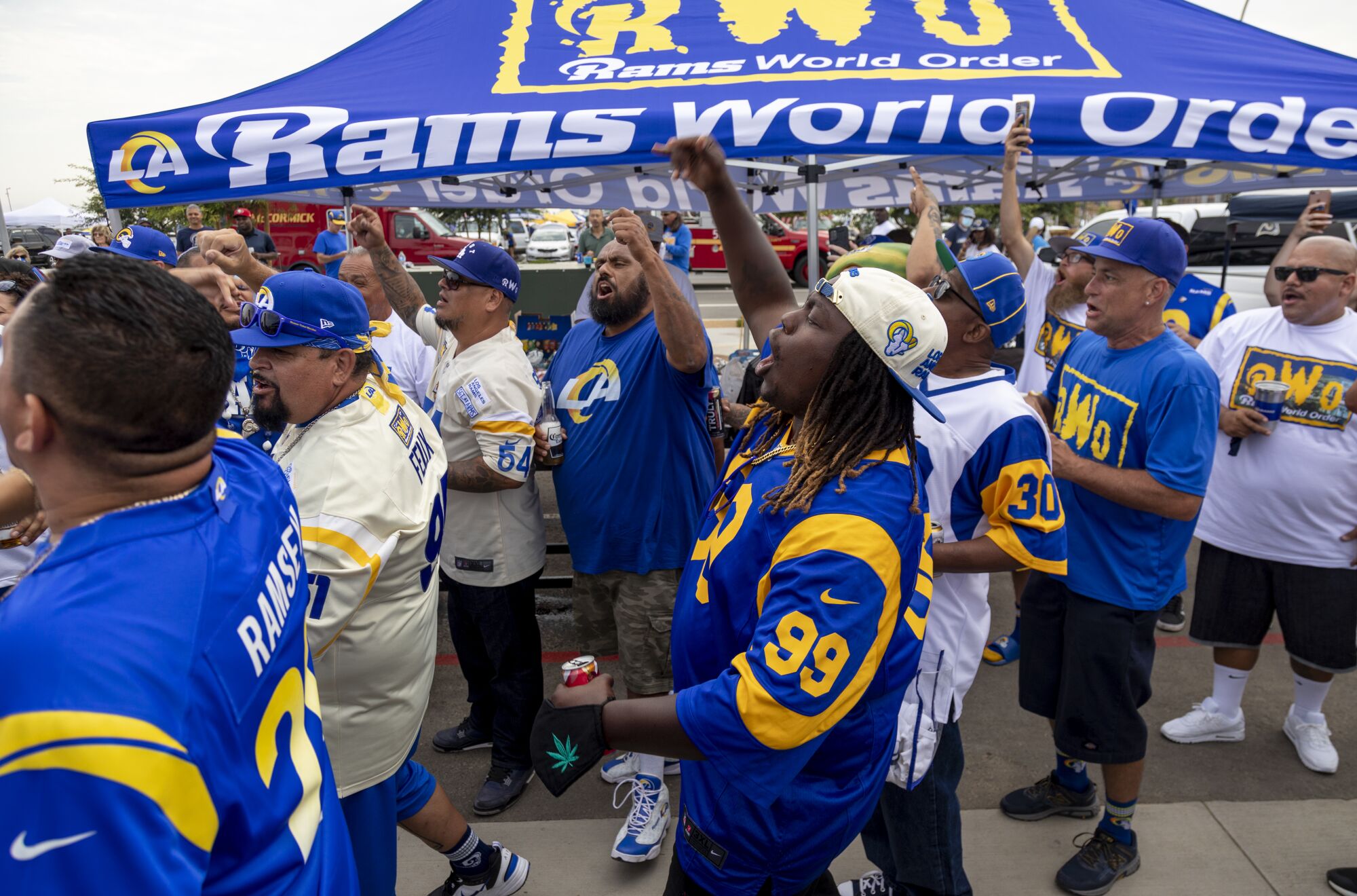 Rams fans make some noise inside the tailgating area Saturday at SoFi Stadium before a preseason game.