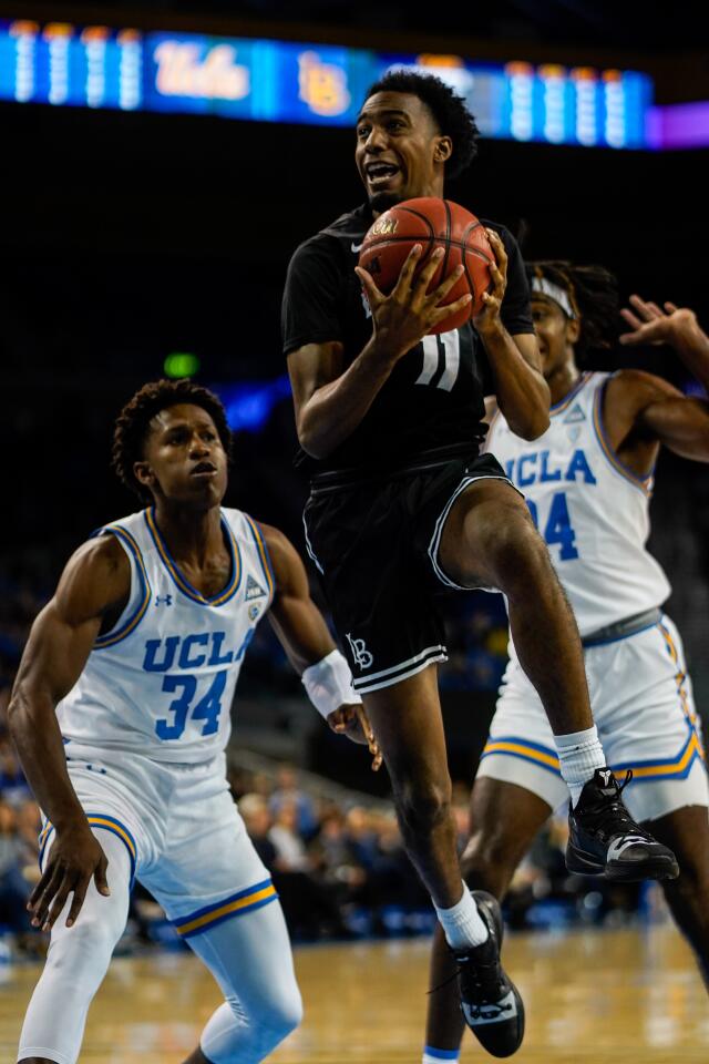 Long Beach State guard Jordan Griffin (11) goes up for a layup during the first half of a game against UCLA on Nov. 6 at Pauley Pavilion.
