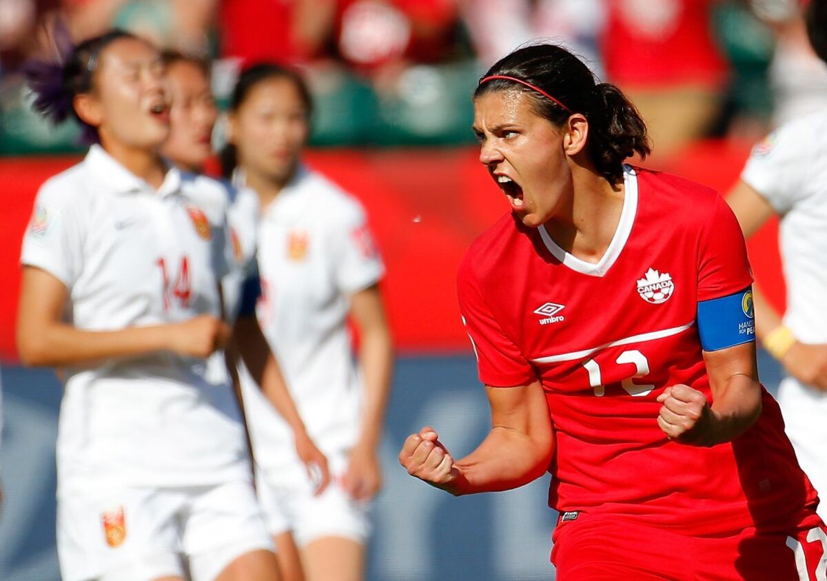 Canada's Christine Sinclair reacts after scoring the go-ahead goal on a penalty kick during stoppage time against China.