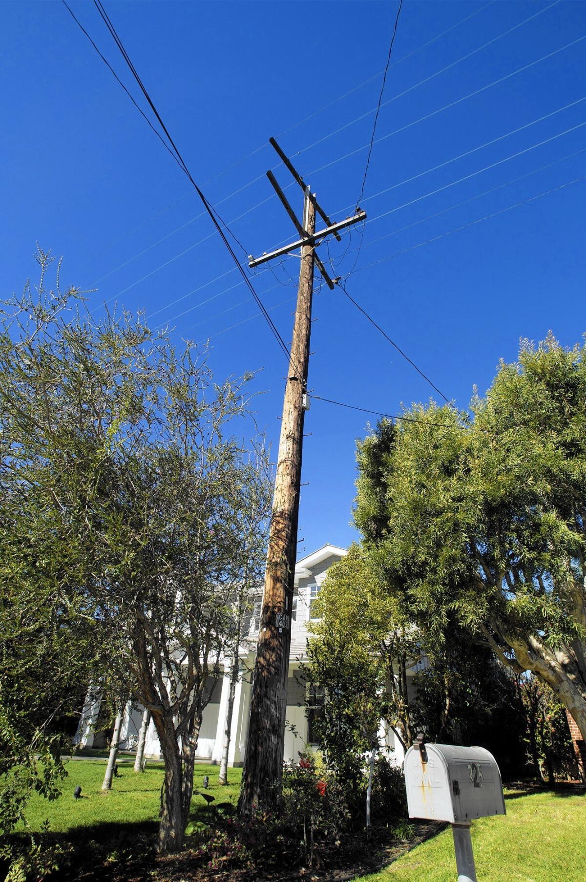 A group of homeowners is asking the Newport Beach City Council to certify a petition to underground utility lines in their Newport Heights neighborhood. The issue has pitted neighbors against one another in the area for more than a year.