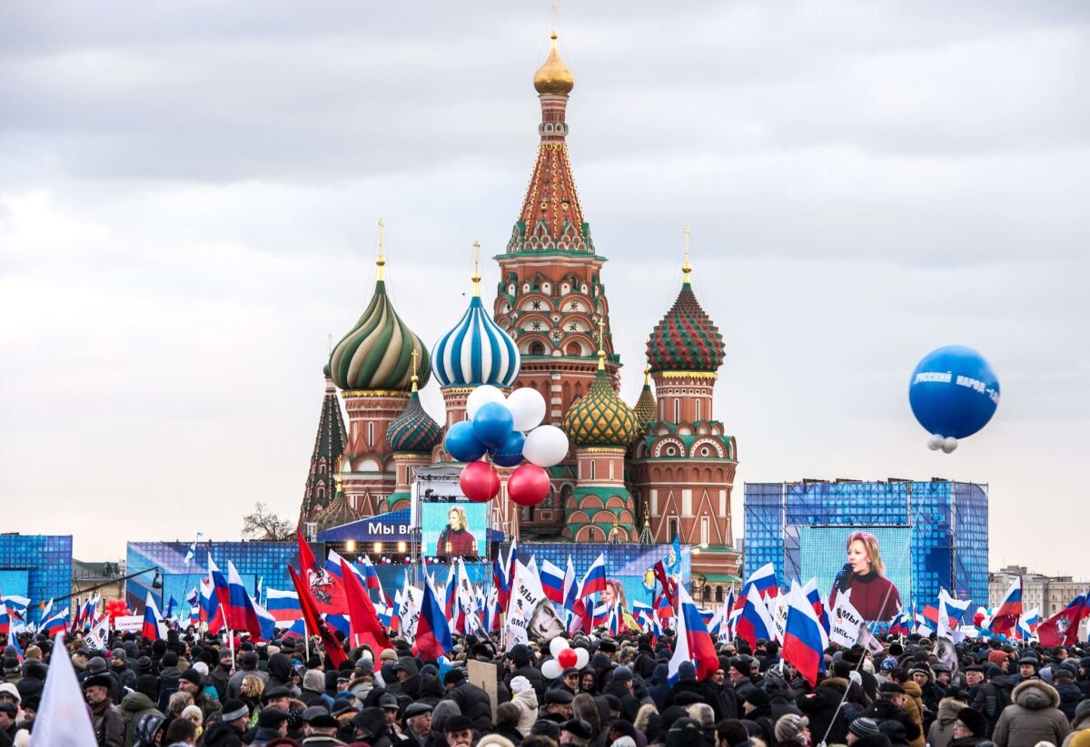 Pro-Kremlin activists rally at the Red Square in Moscow to celebrate the incorporation of Crimea.
