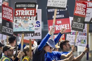 Members of the WGA picket in front of CBS Television City in Los Angeles Sunday, Sept. 24, 2023. 