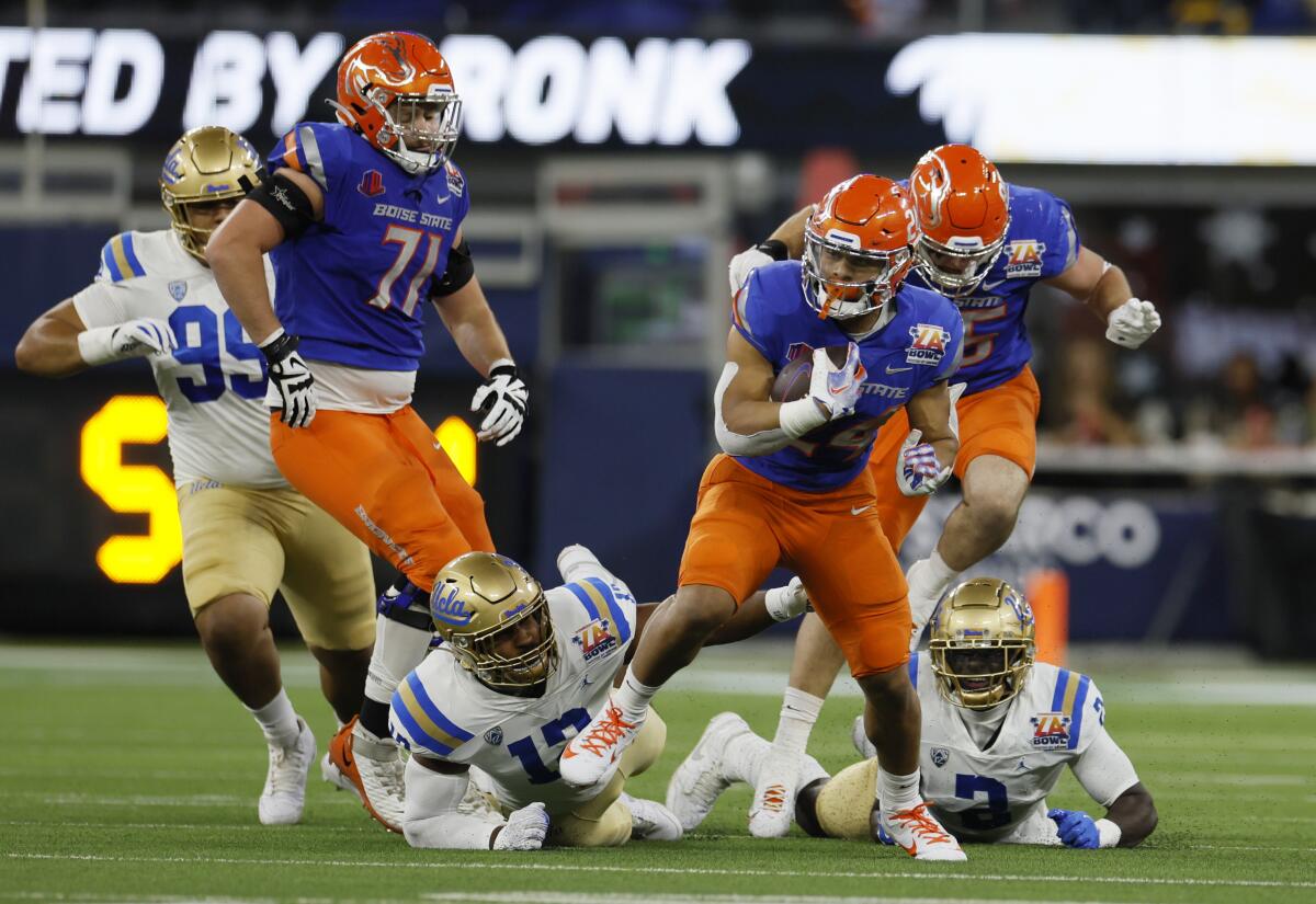 Boise State running back George Holani carries the ball against UCLA in the first half.