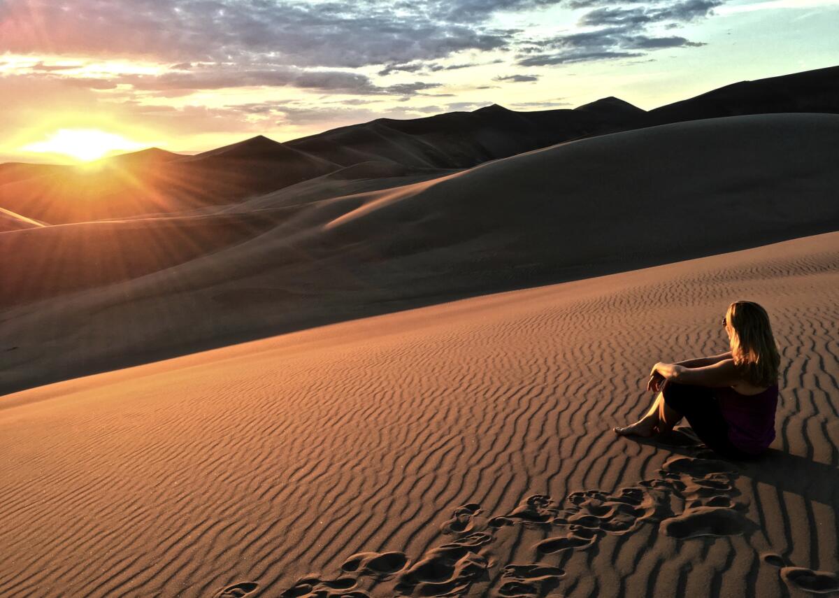 Andrea Kalash at Great Sand Dunes National Park. She made it her mission to visit all 59 full-fledged national parks.