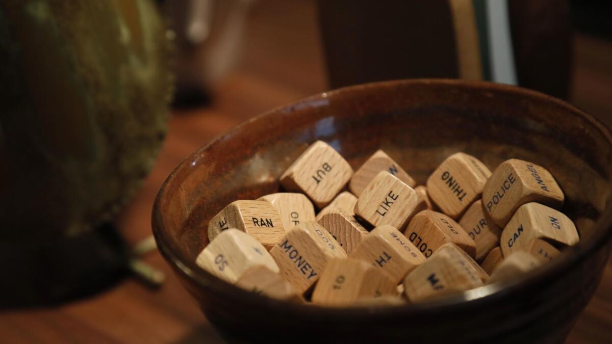 Wooden cubes featuring one word apiece rest in a bowl on the desk of Aline Brosh McKenna, the showrunner of the CW's musical dramedy "Crazy Ex-Girlfriend," at her office in Los Angeles on March 12.