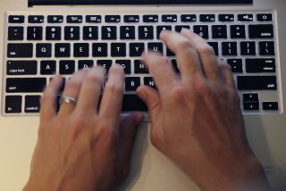 Fingers type on a laptop keyboard Monday, June 19, 2017, in North Andover, Mass. (AP Photo/Elise Amendola)