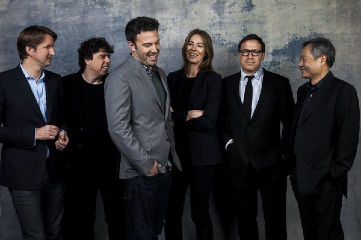 Tom Hooper ("Les Miserables"), left, Sacha Gervasi ("Hitchcock"), Ben Affleck ("Argo"), Kathryn Bigelow ("Zero Dark Thirty"), David O. Russell ("Silver Linings Playbook") and Ang Lee ("Life of Pi") pose before joining the L.A. Times Directors Roundtable.