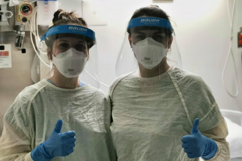 Medical workers (from left) Emilie Guimond and Marie Kim Roger wear Bauer protective shields while working at Cité de Lasanté, a hospital in Laval, Quebec.