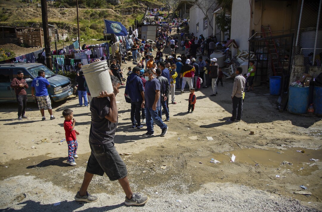 Hundreds of asylum seekers outside a migrant shelter in Tijuana