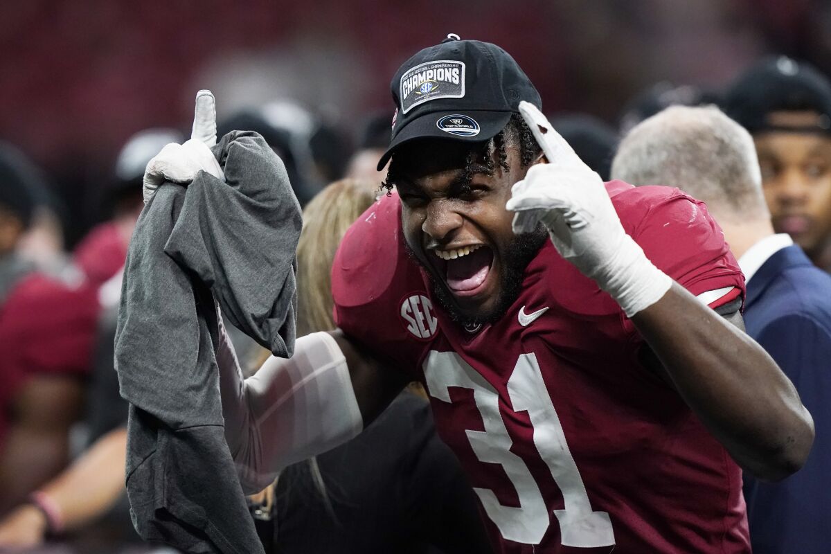 Alabama wide receiver Shatarius Williams (31) celebrates the teams win after the Southeastern Conference championship NCAA college football game between Georgia and Alabama, Saturday, Dec. 4, 2021, in Atlanta. Alabama won 41-24. (AP Photo/Brynn Anderson)