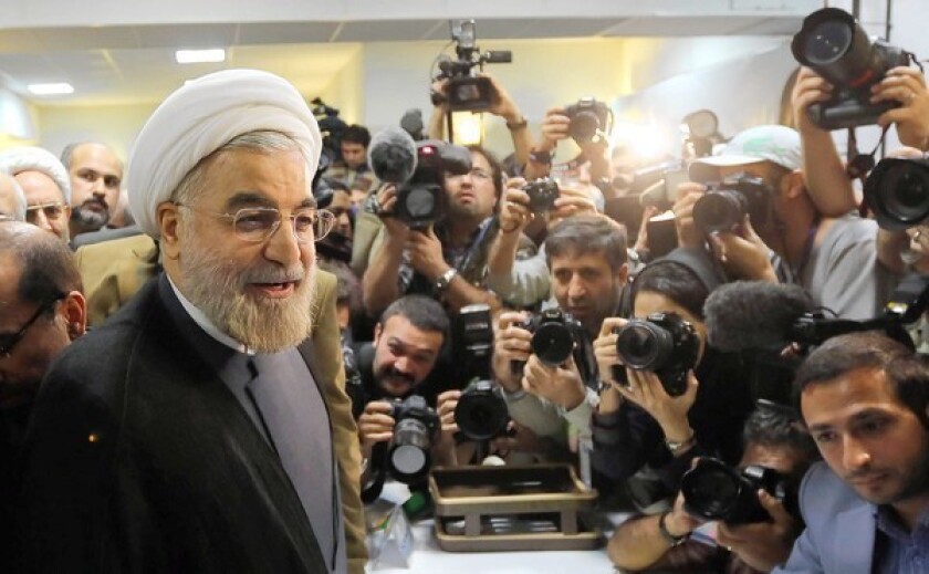Former chief Iranian nuclear negotiator Hassan Rowhani arrives at the Interior Ministry in Tehran to register for the June 14 presidential election.