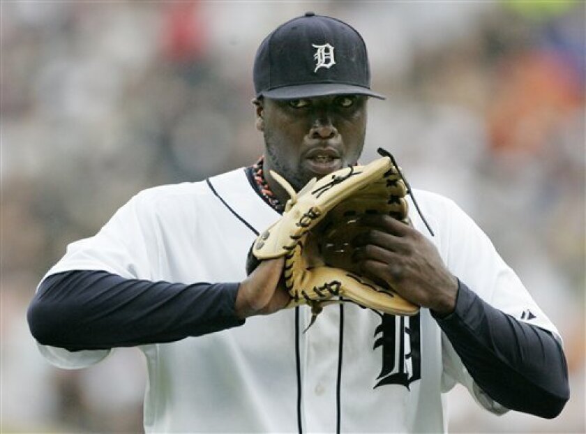 Detroit Tigers pitcher Dontrelle Willis glances towards the dugout after walking Cleveland Indians' Ben Francisco in the second inning of a baseball game Monday, June 9, 2008 in Detroit. Willis was pulled in the second inning after giving up three hits, eight runs and five walks. (AP Photo/Duane Burleson)