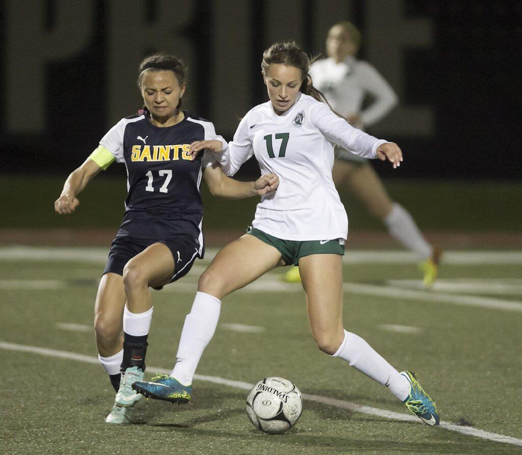 Sage Hill's Lexi Magliarditi, right, and Crean Lutheran's Bryn Williams battle for ball control at midfield.