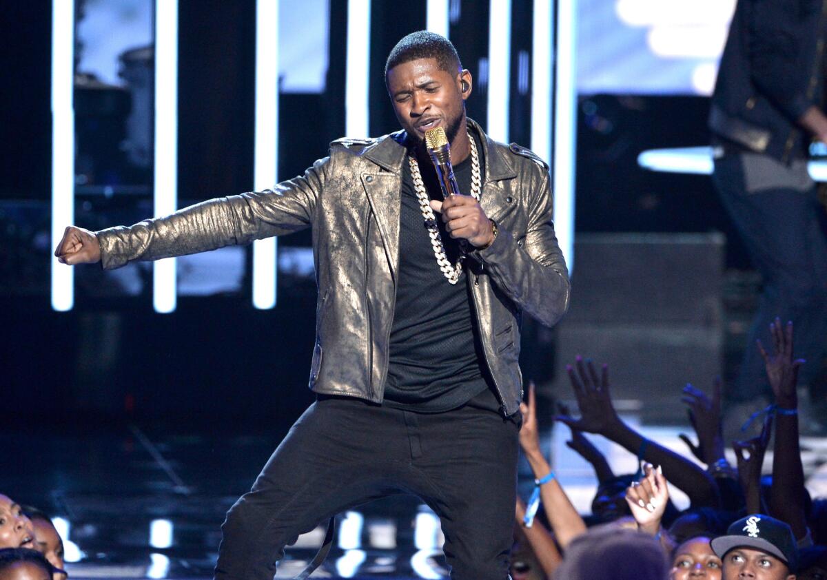 Usher performs onstage during the BET Awards '14 at Nokia Theatre L.A. LIVE on June 29, 2014 in Los Angeles, California.