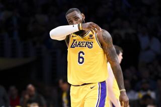 LOS ANGELES, CA - MAY 22: Los Angeles Lakers forward LeBron James wipes his face during the fourth quarter.