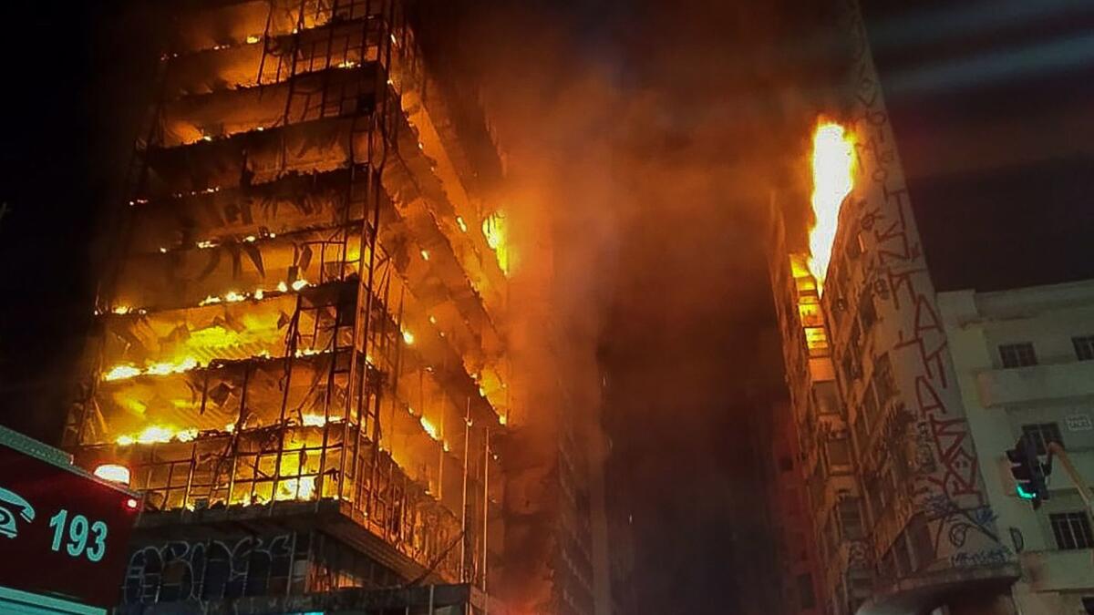 Flames engulf a 25-floor building in Sao Paulo that was occupied by squatters. The structure later collapsed, and at least 1 person was killed.