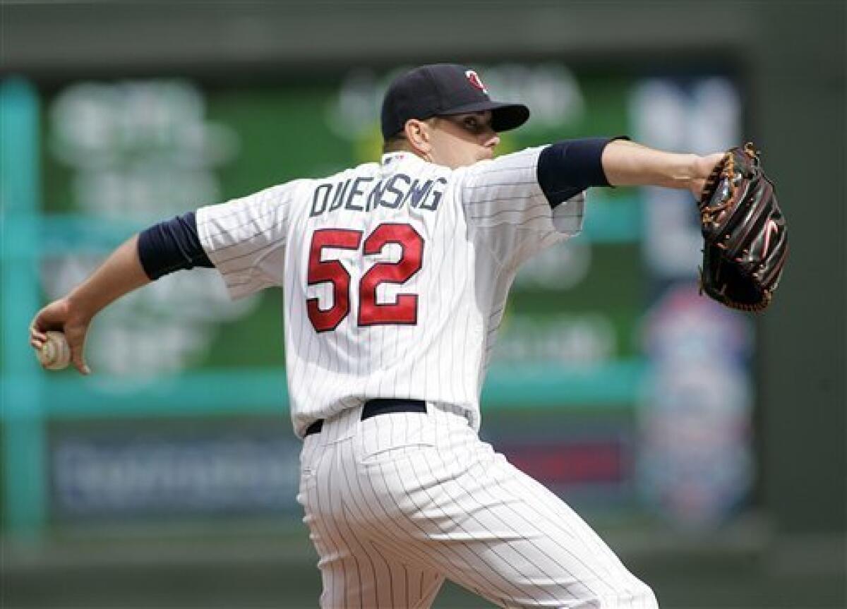 New York Yankees pitcher Joba Chamberlain throws to the Minnesota