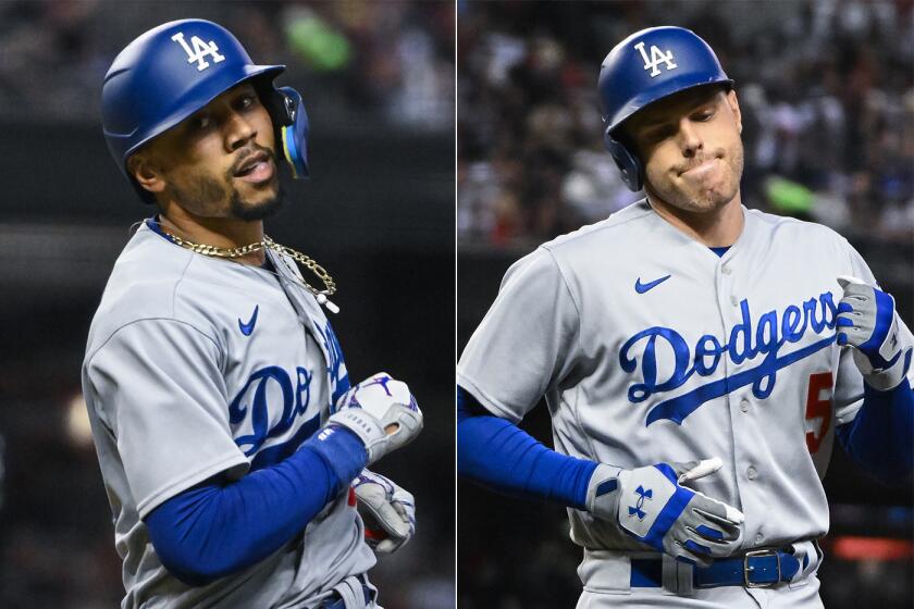 Dodgers stars Mookie Betts, left, and Freddie Freeman during Game 3 of the NLDS.