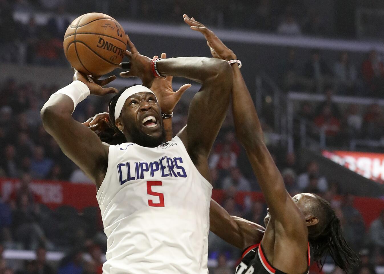Clippers forward Montrezl Harrell goes up strong for an offensive rebound during the second quarter of a game Nov. 11 against the Raptors at Staples Center.