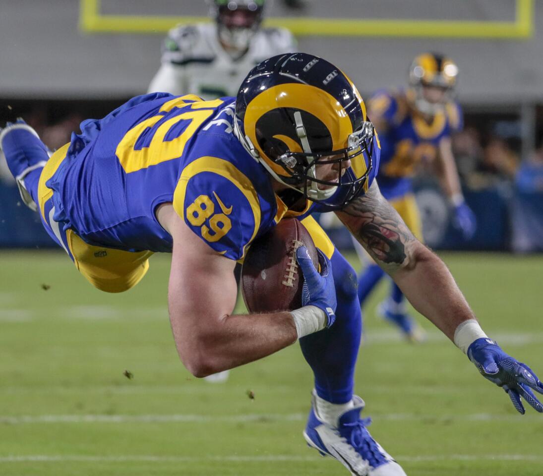 Rams tight end Tyler Higbee hauls in a pass.