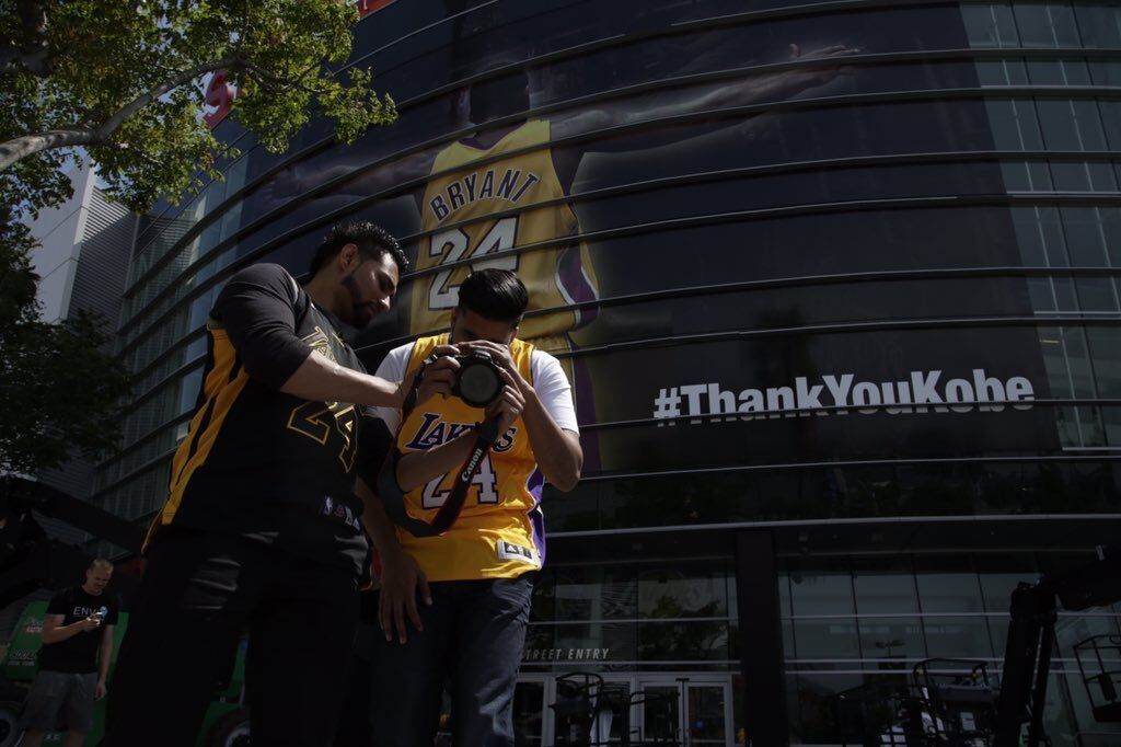 Kobe Bryant fans swarm to Staples Center in Los Angeles to show their love for the Laker great at his last game Wednesday.