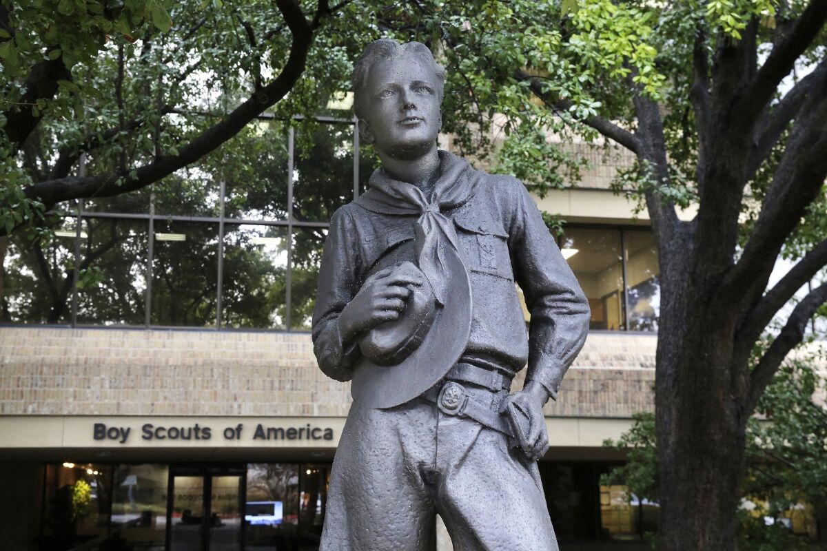 FILE - In this Feb. 12, 2020, file photo, a statue stands outside the Boy Scouts of America headquarters in Irving, Texas. On Monday, March 14, 2022, more than two years after the BSA sought bankruptcy protection amid an onslaught of child sex abuse lawsuits, a federal bankruptcy judge in Delaware convenes a trial to determine whether to approve the BSA’s reorganization plan. The plan includes a fund of more than $2.6 billion to compensate tens of thousands of men who say they were molested as children by Scout leaders and others. (AP Photo/LM Otero, File)