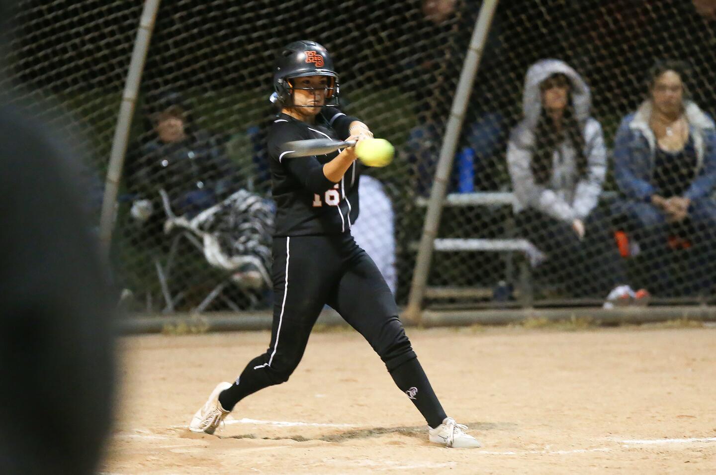 Huntington Beach High's Megan Ryono hits an RBI double during the Michelle Carew Classic game against El Cajon Granite Hills at Peralta Canyon Park in Anaheim on Thursday.