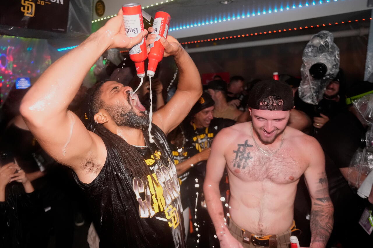 San Diego Padres’ Fernando Tatis Jr., left, and Jackson Merrill, celebrate with teammates.