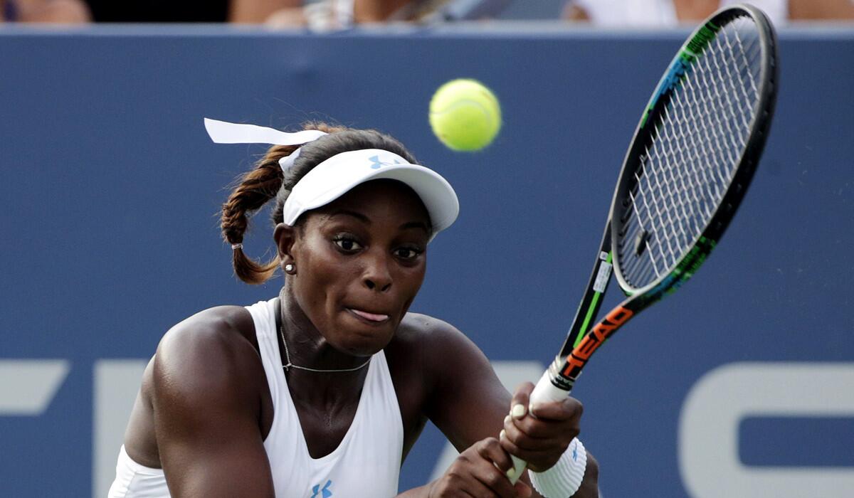 Sloane Stephens returns a shot to Coco Vandeweghe during the first round of the U.S. Open tennis tournament on Monday.