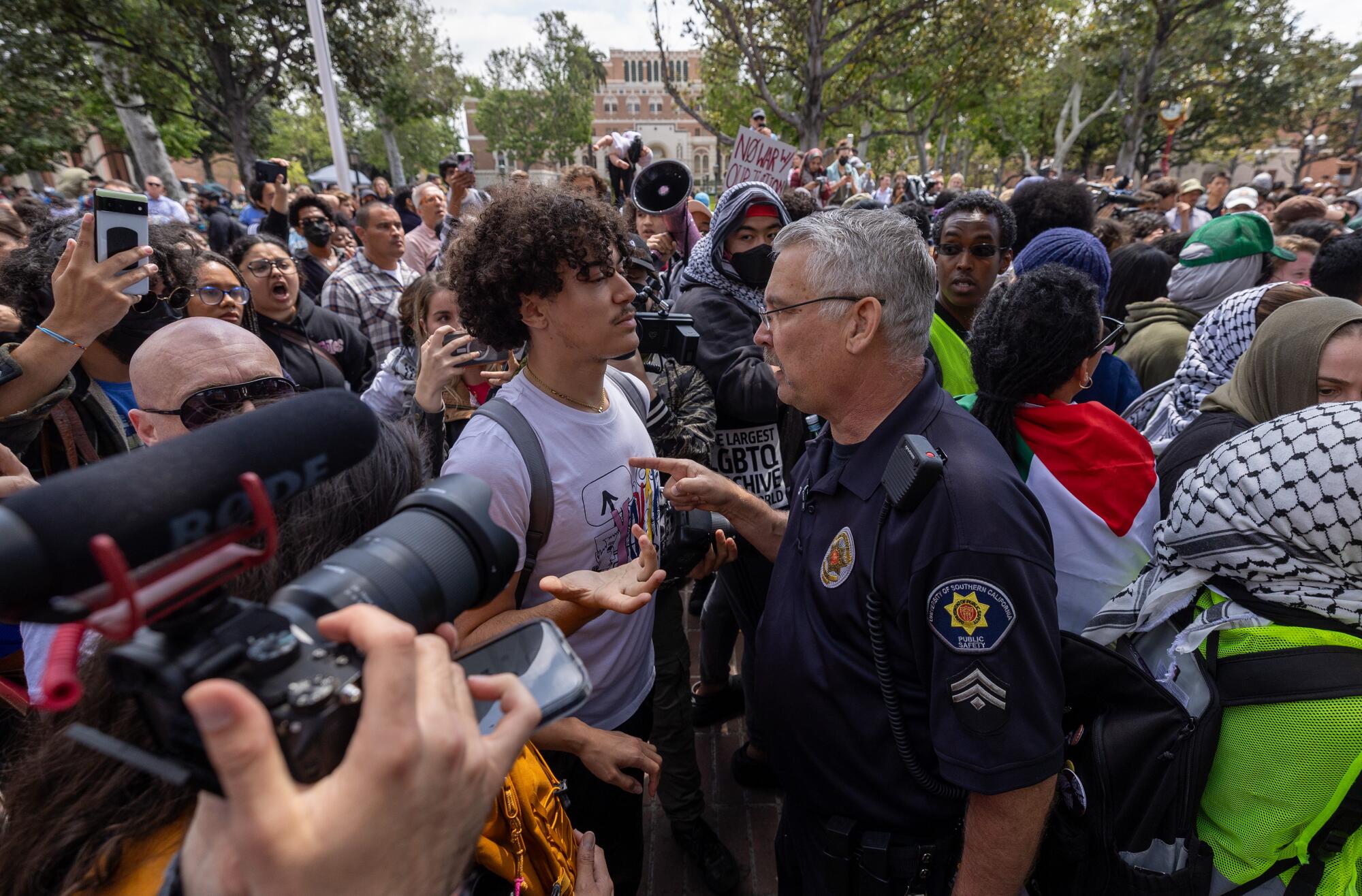 Public safety officers confront pro-Palestinian demonstrators at USC on April 24.