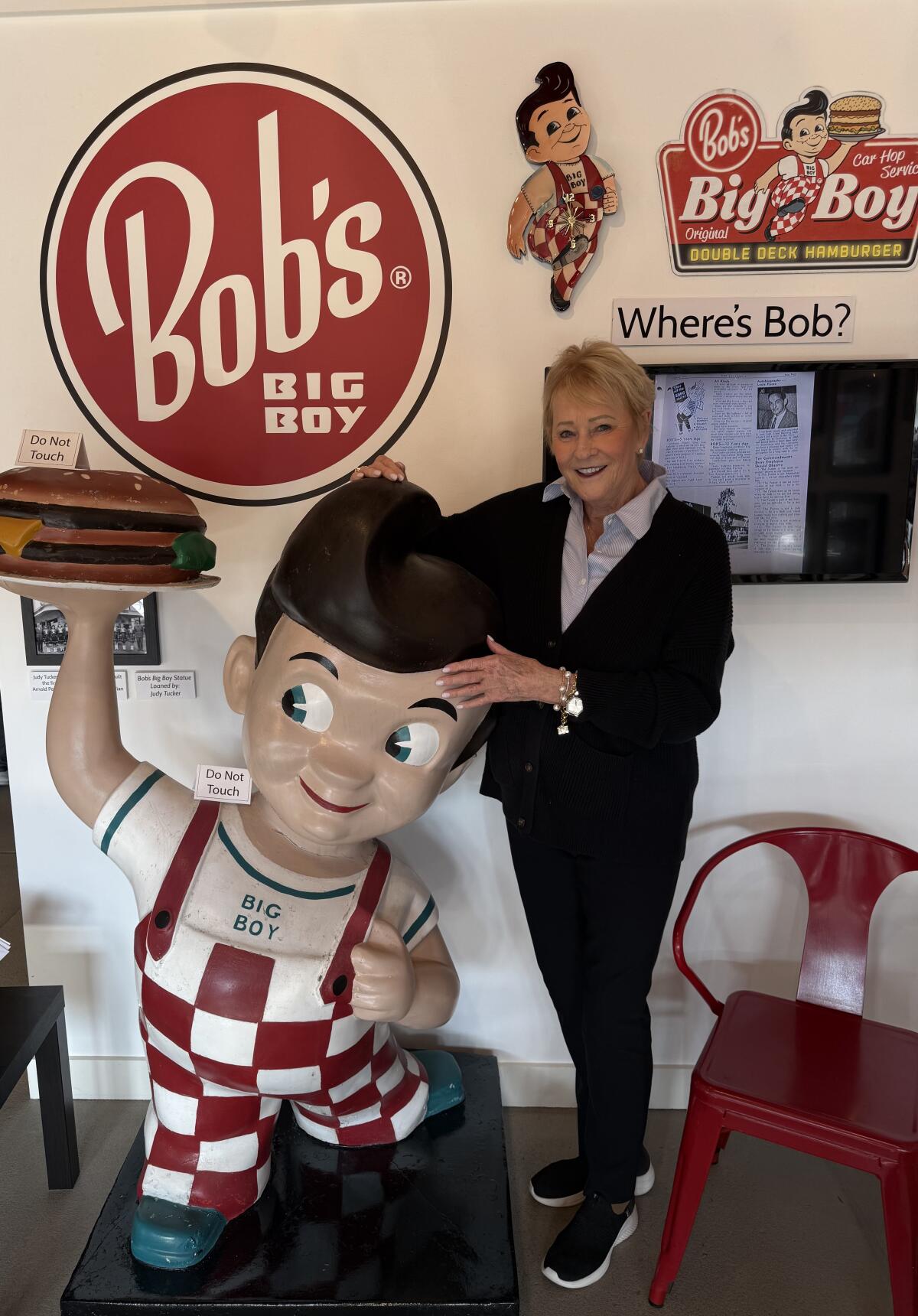 Shirley Pepys, chief executive of Balboa Island Museum, stands next to an iconic Bob’s Big Boy statue.