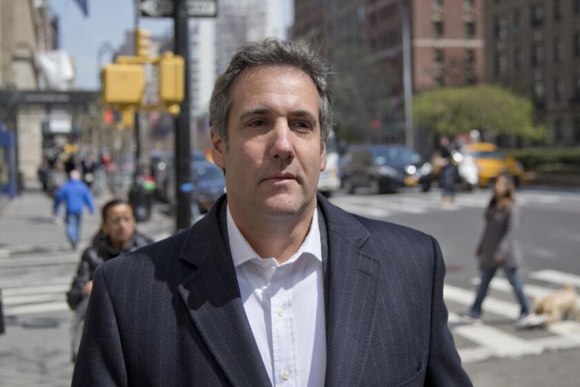 FILE - In this April 11, 2018, file photo, attorney Michael Cohen walks down the sidewalk in New York. Cohen, President Donald Trump's longtime personal lawyer who is under investigation by federal prosecutors in New York, said in his Twitter post Sunday, July 1, that he sat down for an interview with ABC News and his "silence is broken." (AP Photo/Seth Wenig, File)