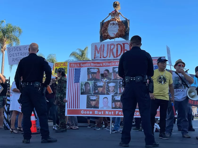 The protesters carried posters alluding to the deaths of American soldiers in Afghanistan, blaming President Biden for the withdrawal of troops.