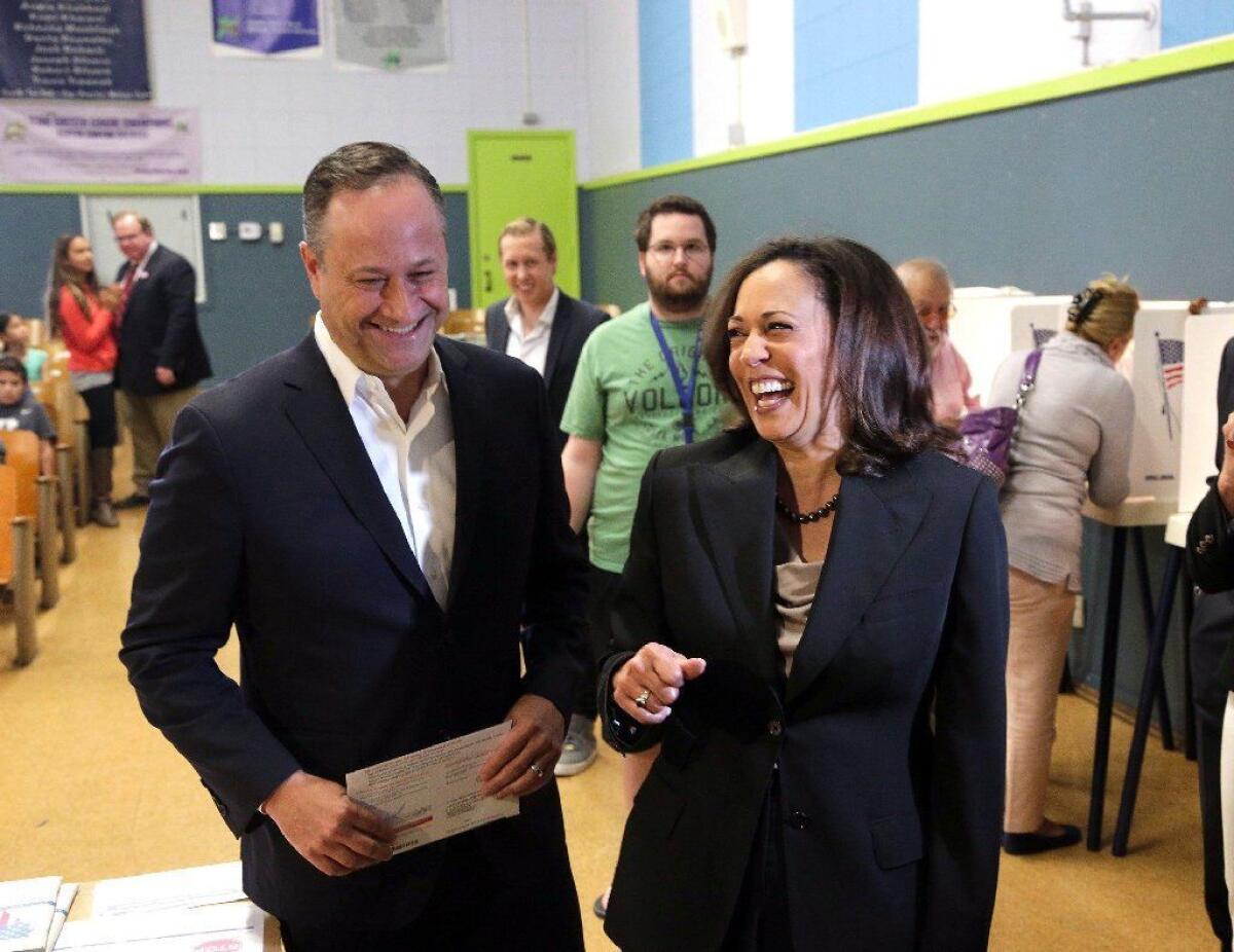 Kamala Harris, right, votes with her husband, Douglas Emhoff, in Los Angeles in 2016.