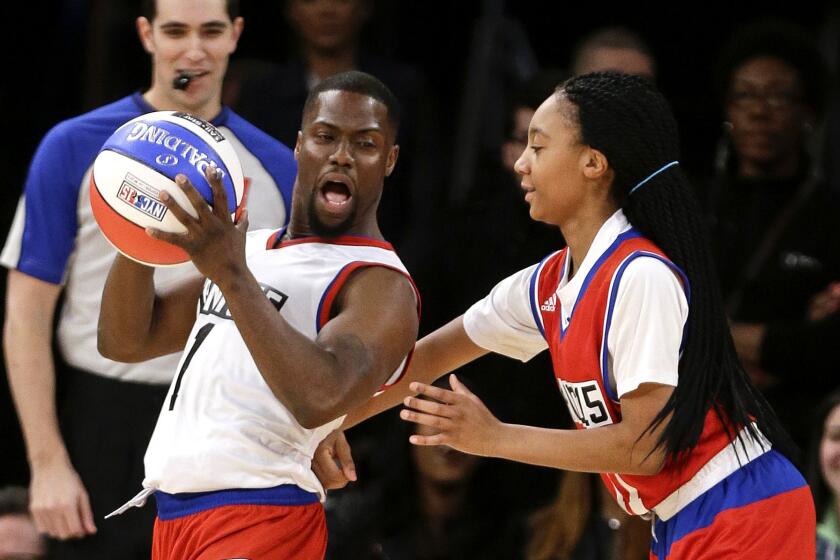 Mo'ne Davis plays defense against Kevin Hart during the first half of the NBA All-Star Celebrity basketball game on Friday.