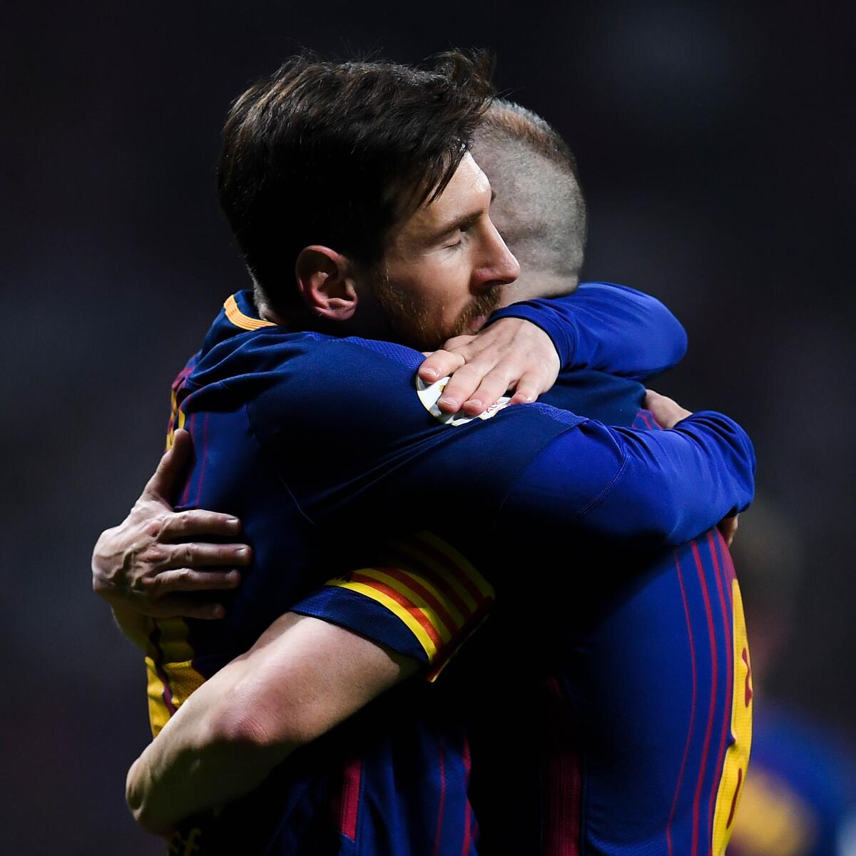 BARCELONA, SPAIN - APRIL 21: Lionel Messi of FC Barcelona hugs his team mate Andres Iniesta of FC Barcelona after Iniesta scored his team's fourth goal during the Spanish Copa del Rey Final match between Barcelona and Sevilla at Wanda Metropolitano stadium on April 21, 2018 in Barcelona, Spain. (Photo by David Ramos/Getty Images)