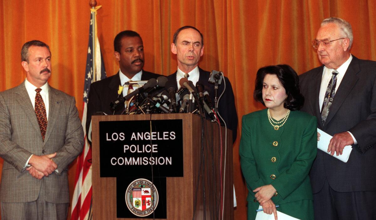 Judge Raymond Fisher at a news conference 