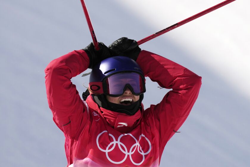 China's Eileen Gu celebrates after winning a gold medal in the women's halfpipe at the 2022 Winter Olympics, Friday, Feb. 18, 2022, in Zhangjiakou, China. (AP Photo/Francisco Seco)