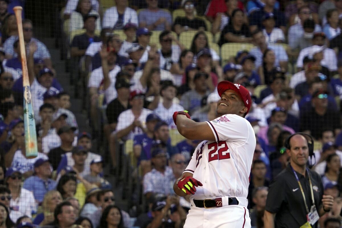 National League's Juan Soto, of the Washington Nationals, tosses his bat during the MLB All-Star baseball Home Run Derby, Monday, July 18, 2022, in Los Angeles. (AP Photo/Mark J. Terrill)