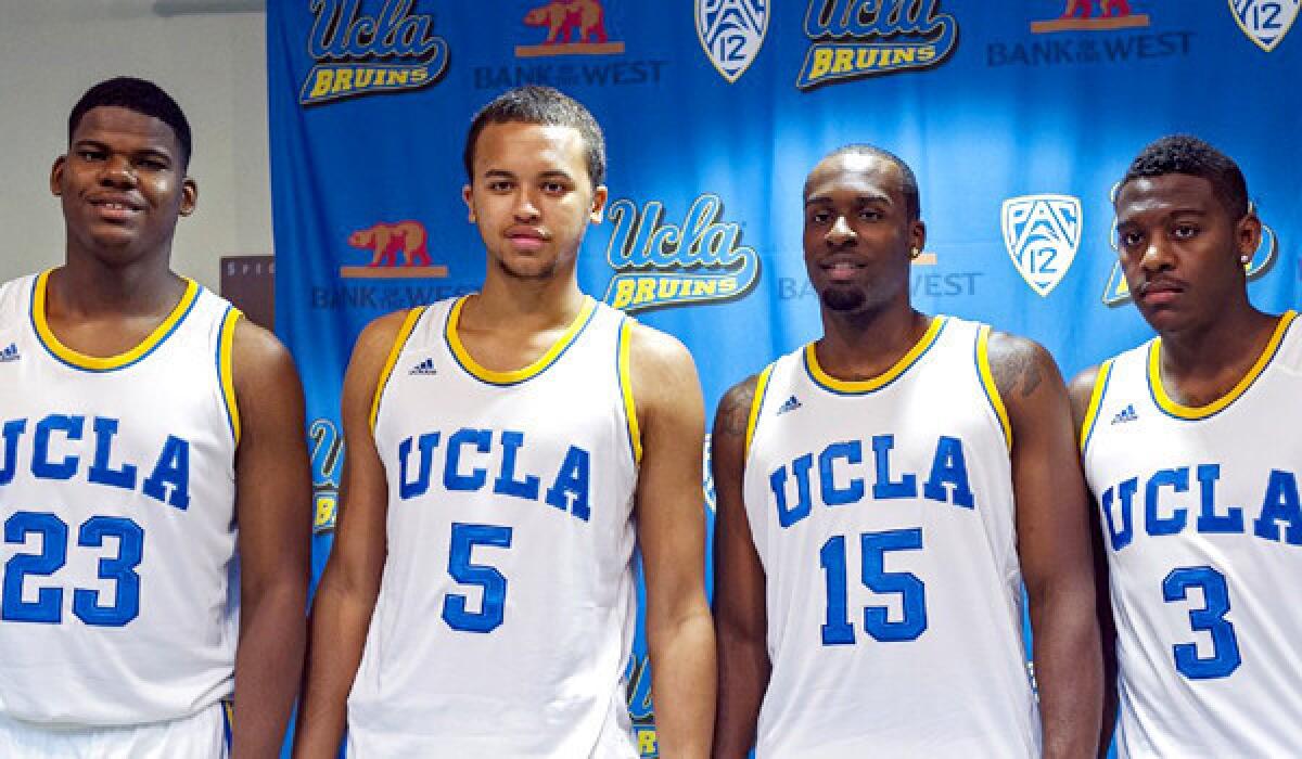 UCLA players Tony Parker, from left, Kyle Anderson, Shabazz Muhammad, Jordan Adams pose for a photo after an NCAA college basketball news conference at the UCLA campus on Oct. 10, 2012.