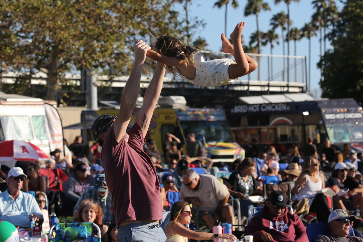 Families have fun during Costa Mesa's Concert in the Park series event at Fairview Park.