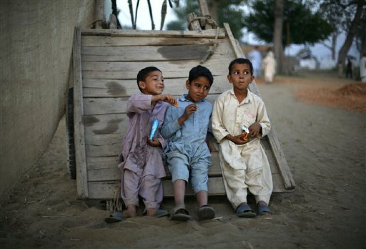 Pakistani children relax at a refugee camp in Swabi, in northwest Pakistan, Tuesday, May 12, 2009. Hundreds of thousands of Pakistanis have fled fighting between the army and Taliban militants in a northwestern valley, raising the risk that public support could turn against an offensive Washington sees as a must-win battle. (AP Photo/Greg Baker)