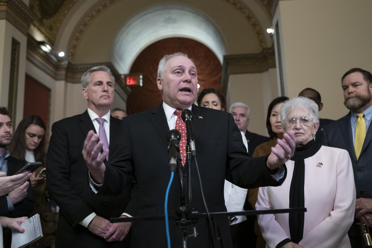 House Majority Leader Steve Scalise speaking at the head of a crowd in the U.S. Capitol